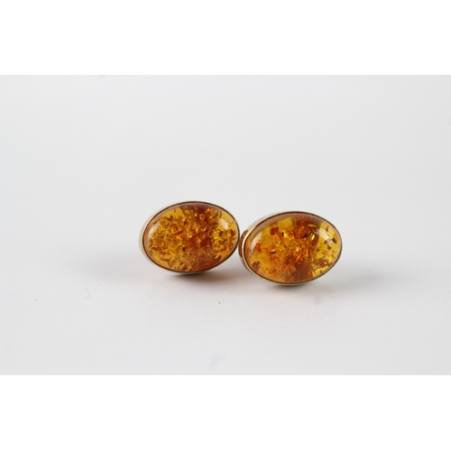 7 - 9ct gold and amber cabochon stud earrings