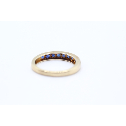 71 - 9ct gold and sapphire channel set ring (2.5g) Size O