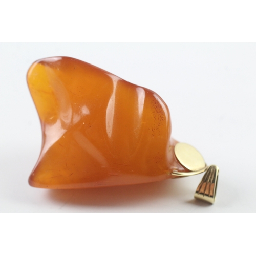 76 - 14ct gold natural large amber pendant