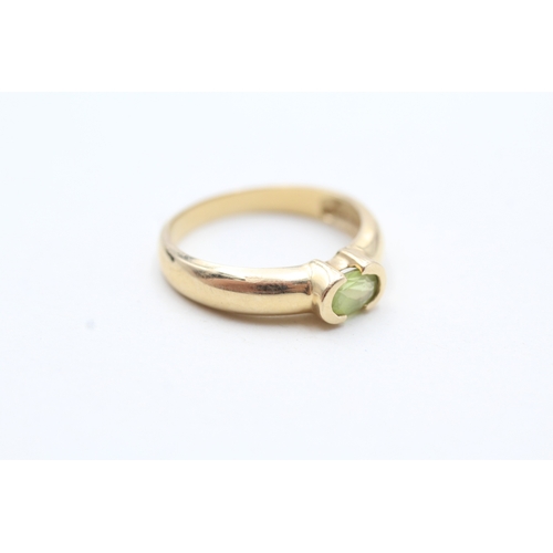 79 - 14ct gold oval cut peridot solitaire ring (2.7g) Size N