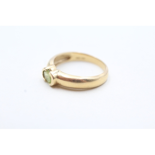 79 - 14ct gold oval cut peridot solitaire ring (2.7g) Size N