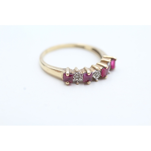 83 - 9ct gold diamond and ruby seven stone eternity ring (3g) Size T