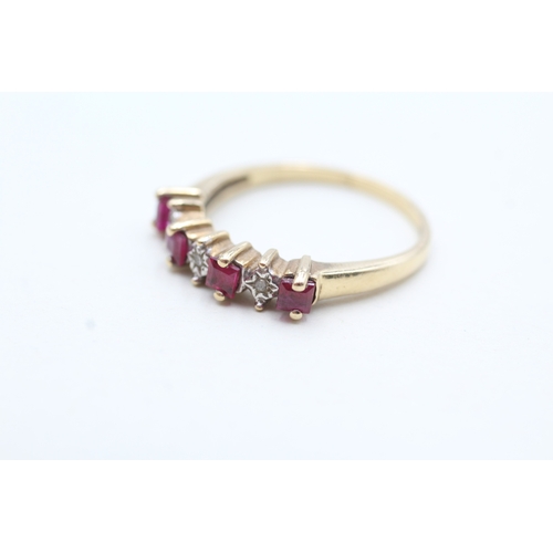 83 - 9ct gold diamond and ruby seven stone eternity ring (3g) Size T