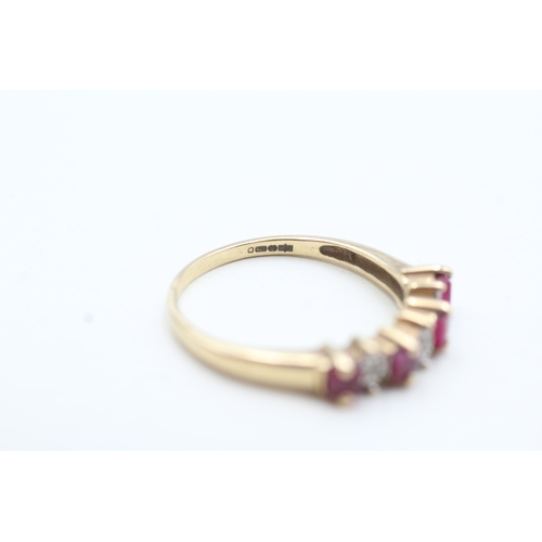 83 - 9ct gold diamond and ruby seven stone eternity ring (3g) Size T