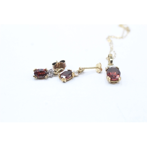 134 - 9ct gold garnet and diamond pendant and earring set (2.5g)