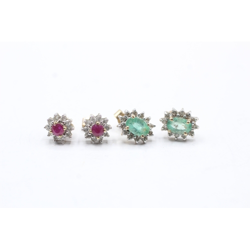 147 - 2 x 9ct gold emerald, ruby and diamond halo stud earrings (2.3g)