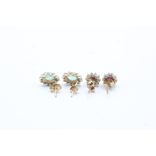 147 - 2 x 9ct gold emerald, ruby and diamond halo stud earrings (2.3g)