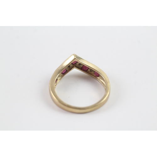 153 - 9ct gold ruby and diamond wishbone dress ring Size M