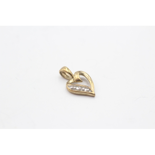 161 - 2x 9ct gold diamond heart shape pendants (1.8g)