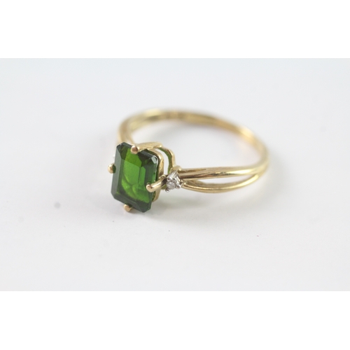 182 - 9ct gold diamond and green gemstone dress ring Size P