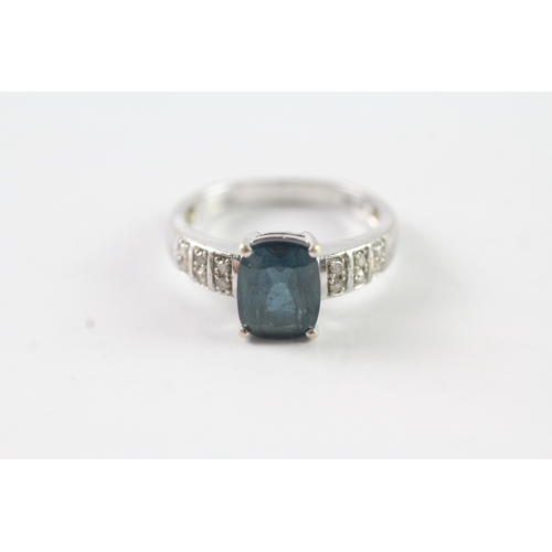 201 - 9ct gold diamond and blue gemstone dress ring Size O