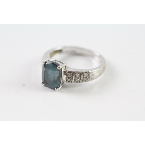 201 - 9ct gold diamond and blue gemstone dress ring Size O