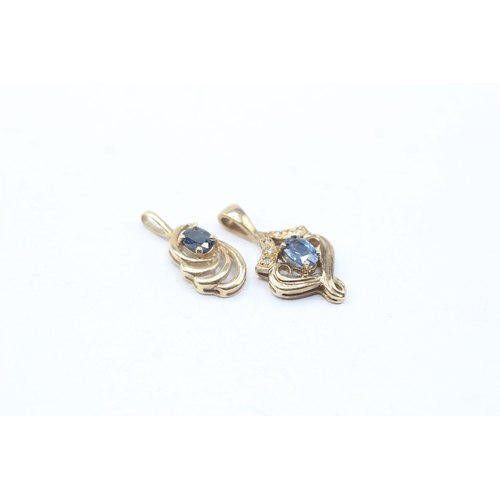 216 - 2 x 9ct gold sapphire and diamond pendants (2.6g)