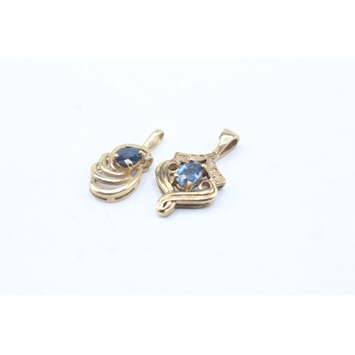 216 - 2 x 9ct gold sapphire and diamond pendants (2.6g)