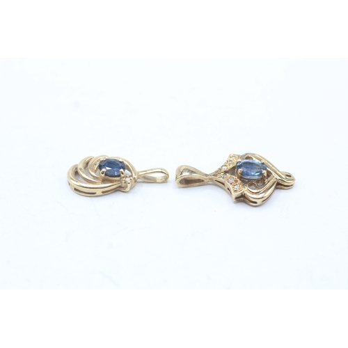 216 - 2 x 9ct gold sapphire and diamond pendants (2.6g)