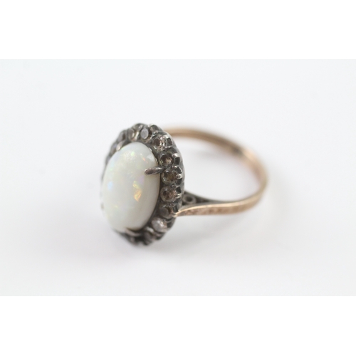 220 - 9ct gold opal and diamond halo ring (3.9g) as seen Size M