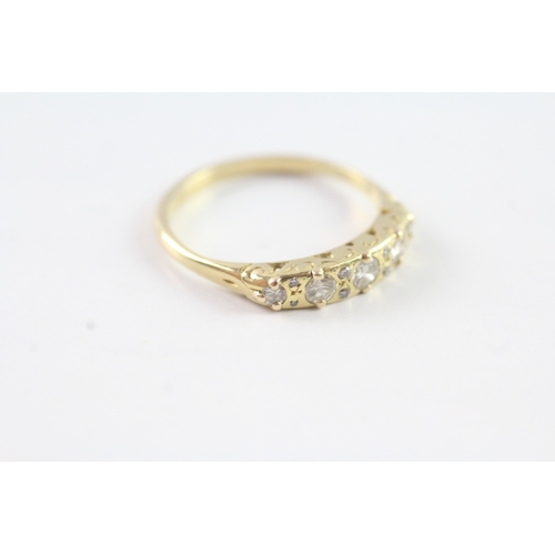 223 - 18ct gold vintage diamond dress ring with a patterned gallery (3g) Size P