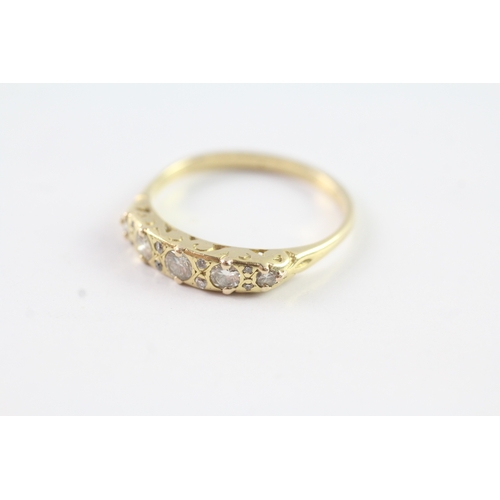 223 - 18ct gold vintage diamond dress ring with a patterned gallery (3g) Size P