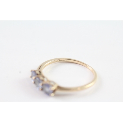 241 - 9ct gold tanzanite trilogy ring (1.8g) Size S