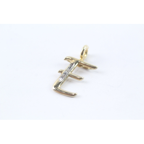 64 - 9ct gold diamond initial 'E' charm (0.7g) Size K