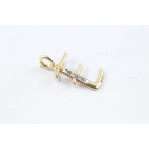 64 - 9ct gold diamond initial 'E' charm (0.7g) Size K