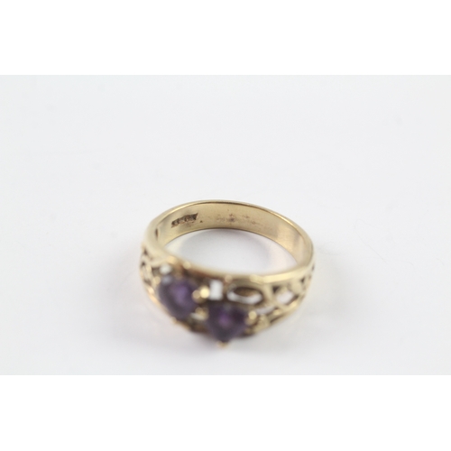 71 - 9ct gold two stone amethyst ring Size L 1/2