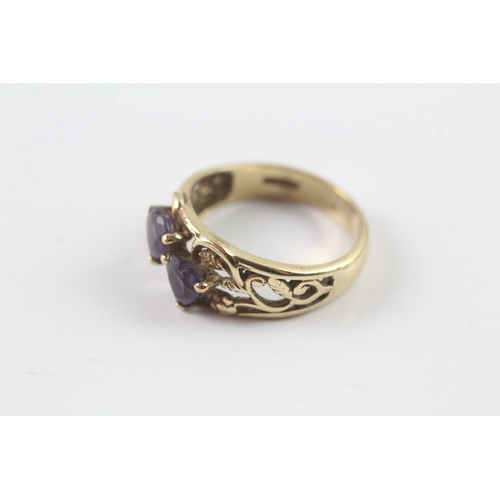 71 - 9ct gold two stone amethyst ring Size L 1/2