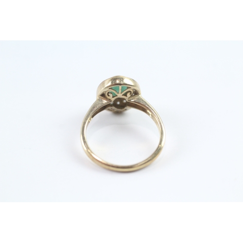 84 - 9ct gold emerald and diamond halo dress ring Size N