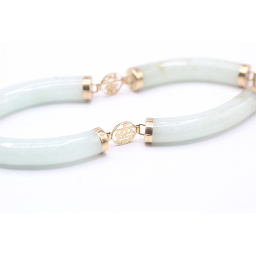 85 - 14ct gold jade bracelet with Chinese symbols (19.7g)