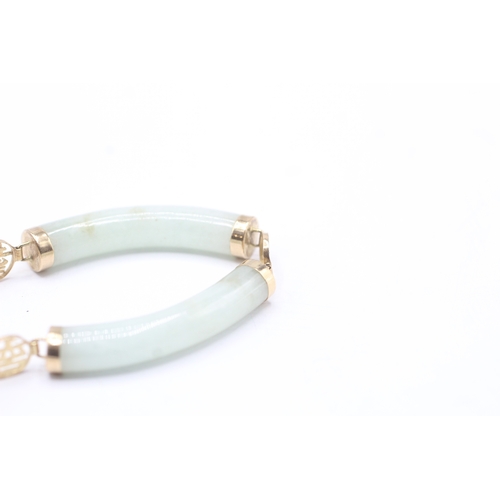 85 - 14ct gold jade bracelet with Chinese symbols (19.7g)