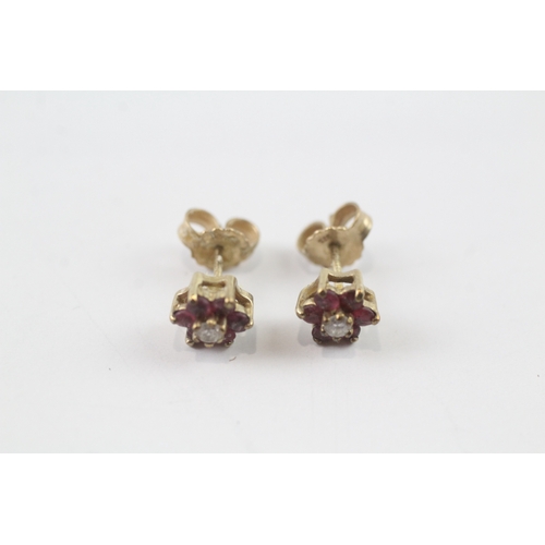 93 - 9ct gold diamond and ruby flower stud earrings (1.2g)