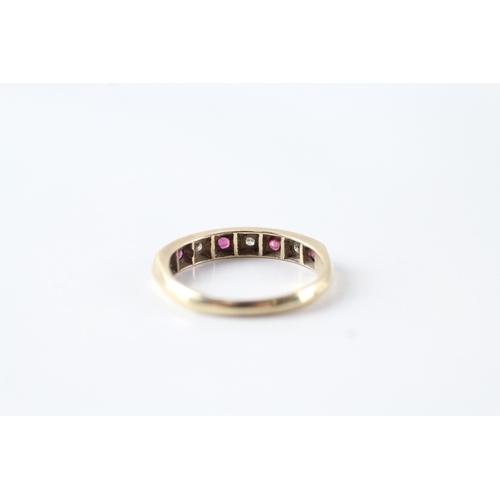 104 - 9ct gold ruby and diamond half eternity dress ring (1.6g) Size L