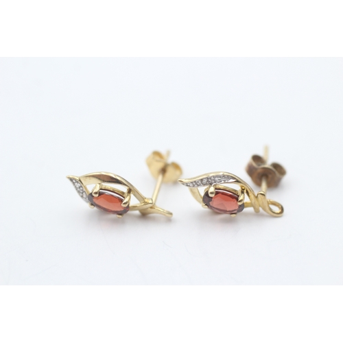 115 - 9ct gold garnet & diamond stud earrings (1.4g)