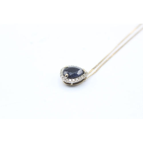 116 - 9ct gold sapphire and diamond halo pendant on chain (1.5g)