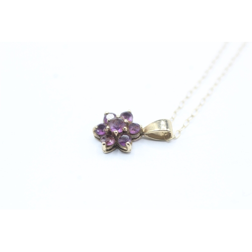 122 - 9ct gold amethyst floral pendant on chain (1.2g)