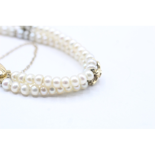 130 - 9ct gold cultured pearl and diamond bracelet (12.1g)