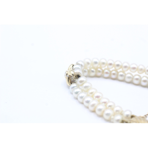 130 - 9ct gold cultured pearl and diamond bracelet (12.1g)