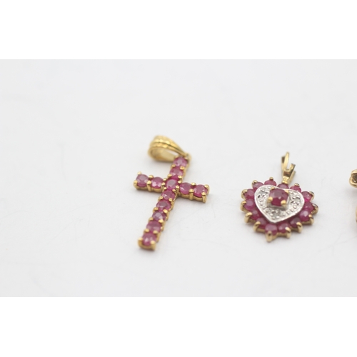 133 - 3 x 9ct gold ruby and diamond pendants (2.2g)