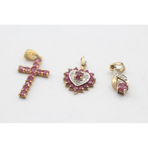 133 - 3 x 9ct gold ruby and diamond pendants (2.2g)