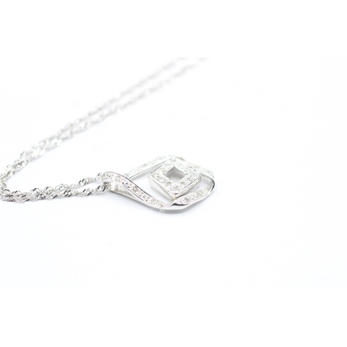 137 - 9ct gold diamond pendant necklace (2.2g)