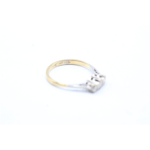 141 - 18ct gold three stone diamond ring (1.8g) Size J