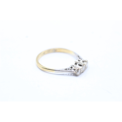 141 - 18ct gold three stone diamond ring (1.8g) Size J