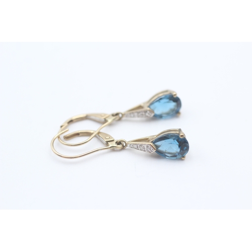 146 - 9ct gold pear cut blue gemstone drop earrings (1.8g)