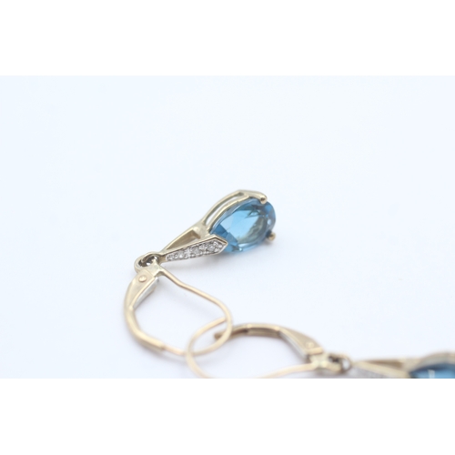 146 - 9ct gold pear cut blue gemstone drop earrings (1.8g)