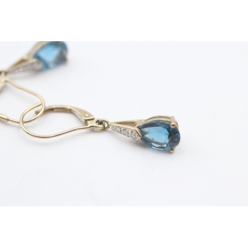 146 - 9ct gold pear cut blue gemstone drop earrings (1.8g)