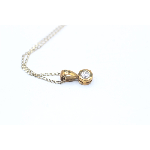 161 - 9ct gold single diamond pendant on chain (1.1g)