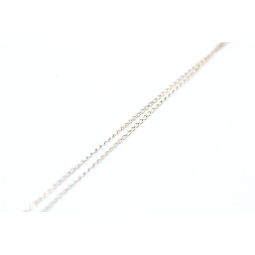 161 - 9ct gold single diamond pendant on chain (1.1g)