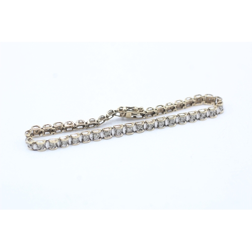 164 - 9ct gold diamond line bracelet (8.1g)