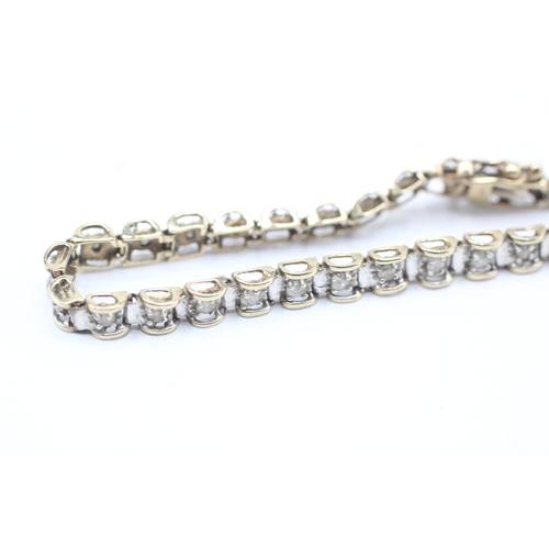 164 - 9ct gold diamond line bracelet (8.1g)