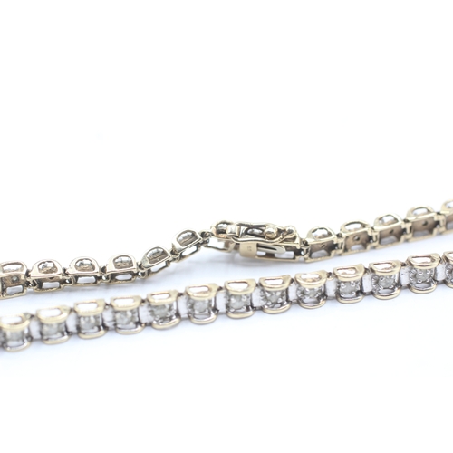 164 - 9ct gold diamond line bracelet (8.1g)